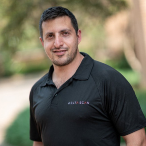 Customer story: Man in Delta Scan shirt. Happy customer testimonial.